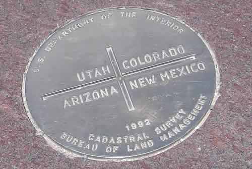 Four Corners Monument survey plaque marking the meeting point of Utah, Colorado, Arizona and New Mexico