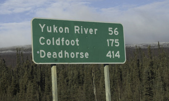 Sign along the Dalton Highway: Yukon River - 56 miles ... Deadhorse - 414 miles