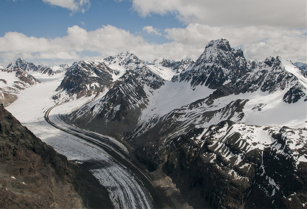 Glacier sliding through the rugged peaks of the Neacola Mountains in winter at Lake Clark National Park 