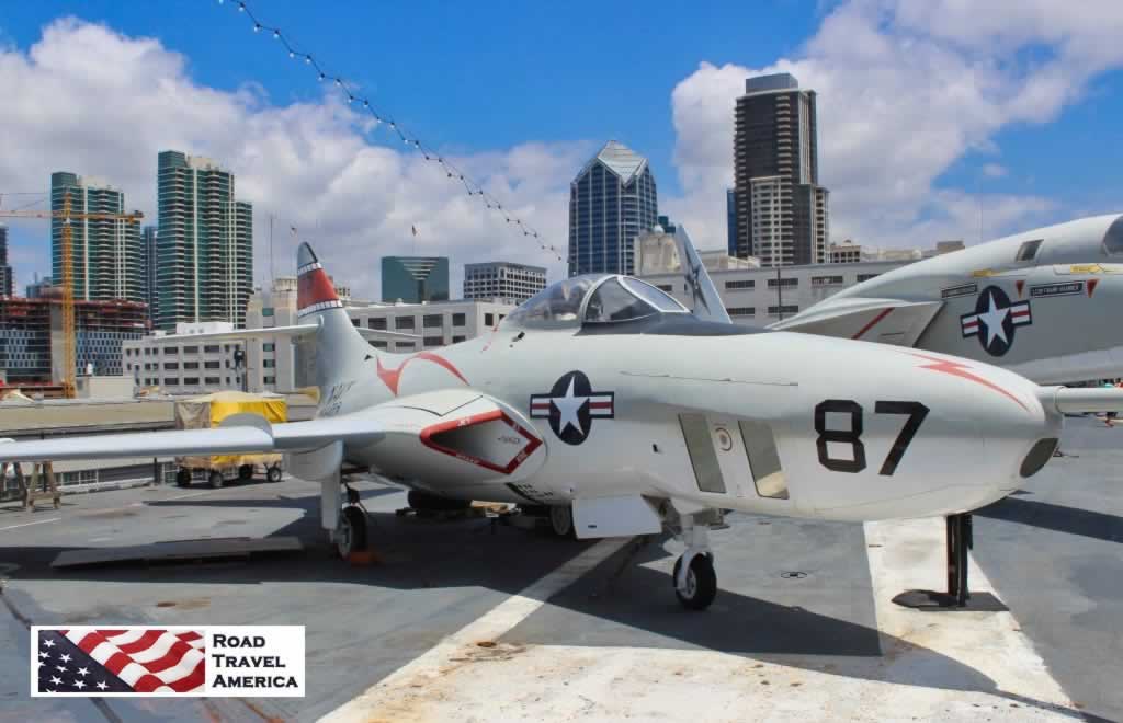 On deck at the USS Midway Museum, with the San Diego skyline in the background