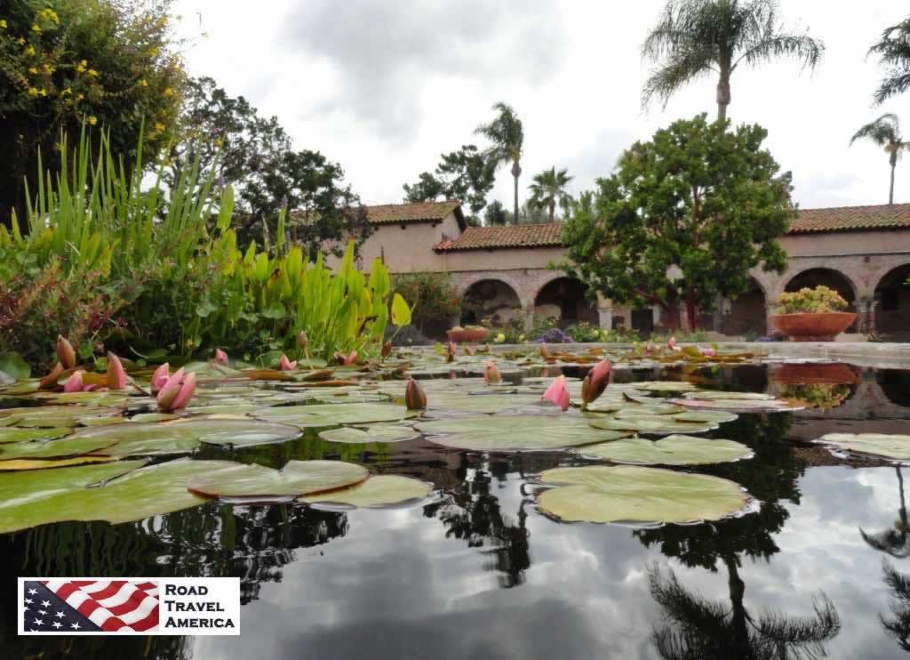 A quiet pond with lily pads on the grounds of the San Juan Capistrano Mission