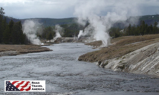 Geysers and steam vents along the river near Old Faithful at Yellowstone National Park