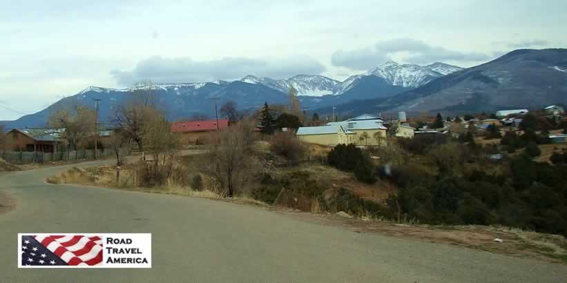 Scene along the Turquoise Trail with snow-capped mountains in the distance