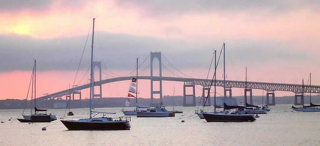 View of the harbor and the Newport Bridge at sunset