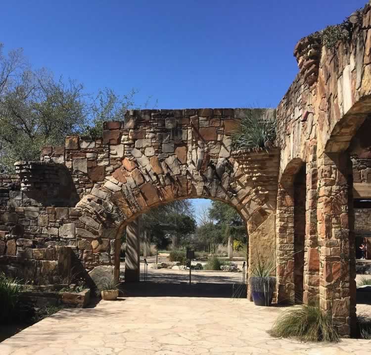 Stone archways at the entrance area to the Lady Bird Johnson Wildflower Center in Austin, Texas