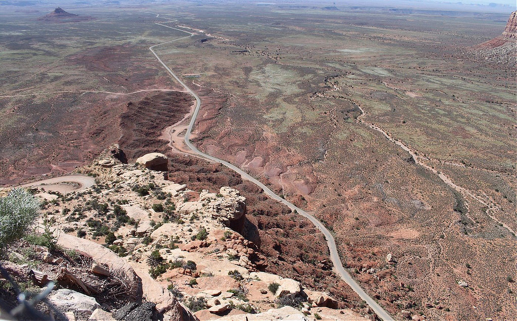 The Valley of the Gods seen in the distance from high above on the Moki Dugway
