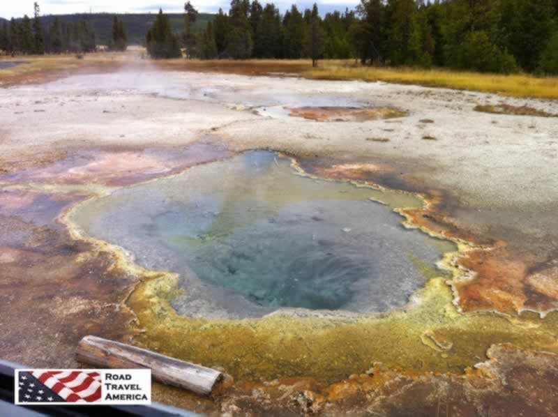 Brilliant, colorful hot water pool at Yellowstone National Park